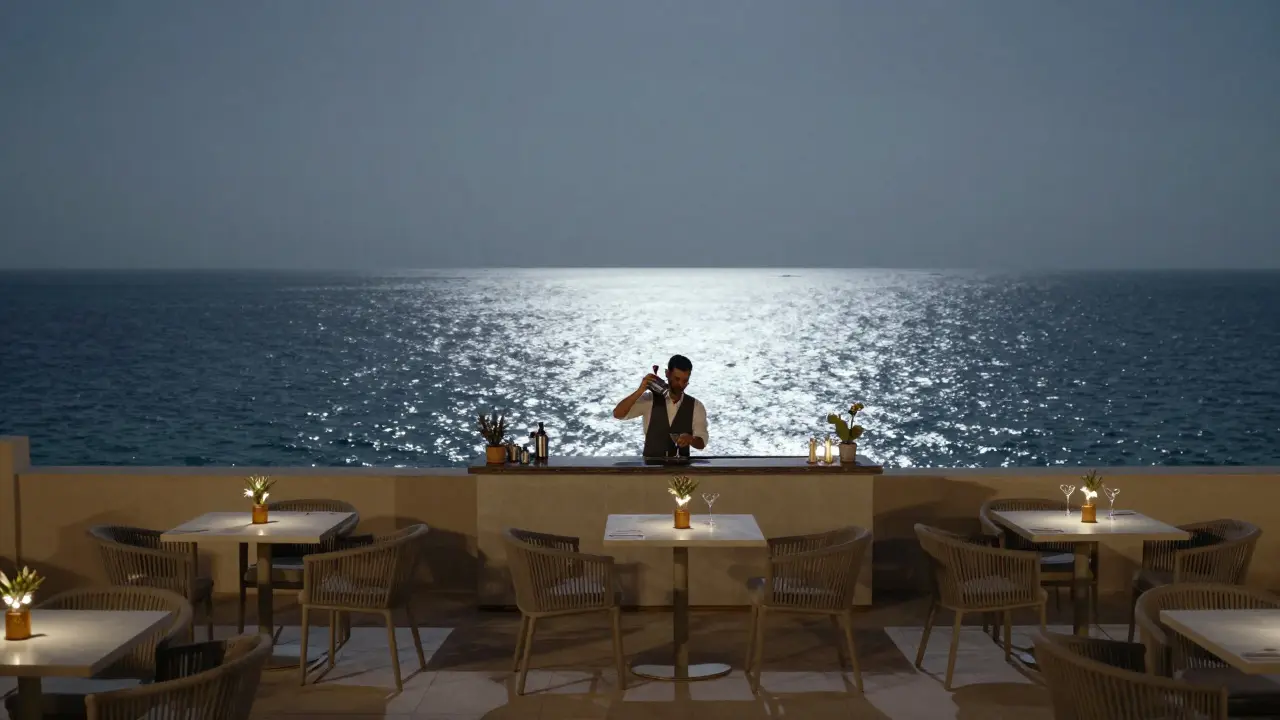 A quiet rooftop bar at night with a view of Abu Dhabi's skyline and the Gulf beyond.